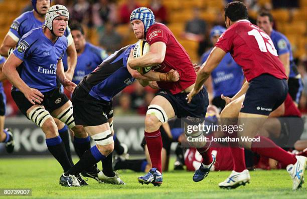 John Roe of the Reds makes a break during the round ten Super 14 match between the Queensland Reds and the Western Force at Suncorp Stadium on April...