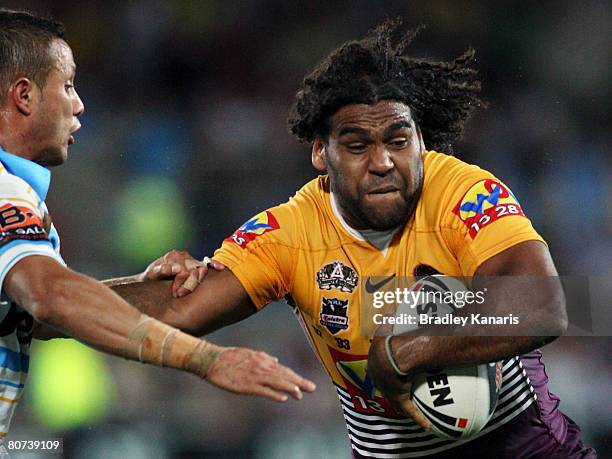 Sam Thaiday of the Broncos attempts to push away from the tackle of Scott Prince of the Titans during the round six NRL match between the Gold Coast...