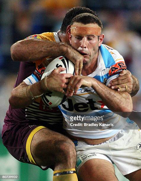 Anthony Laffranchi of the Titans takes on the Broncos defence during the round six NRL match between the Gold Coast Titans and the Brisbane Broncos...