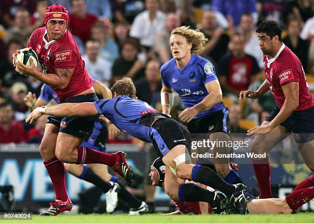 Leroy Houston of the Reds makes a break during the round ten Super 14 match between the Queensland Reds and the Western Force at Suncorp Stadium on...