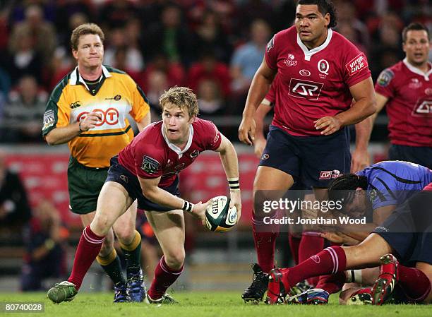 Ben Lucas of the Reds passes the ball during the round ten Super 14 match between the Queensland Reds and the Western Force at Suncorp Stadium on...