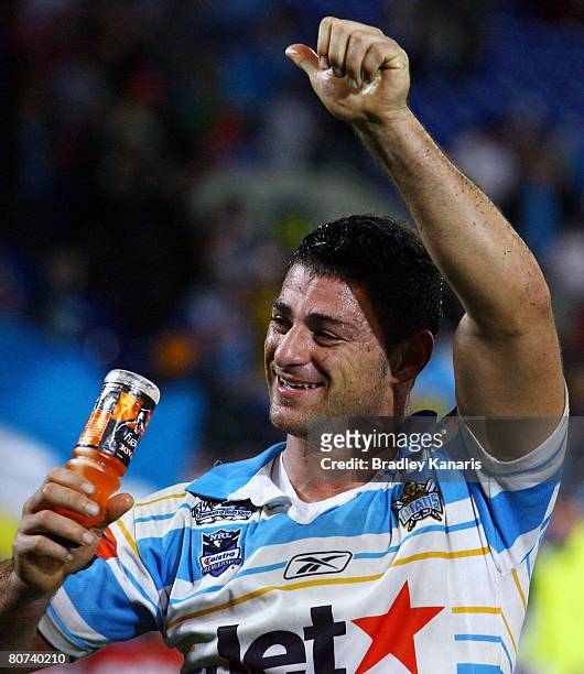 Mark Minichiello of the Titans celebrates victory after the round six NRL match between the Gold Coast Titans and the Brisbane Broncos at Skilled...