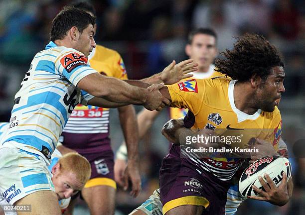 Sam Thaiday of the Broncos takes on the Titans defence during the round six NRL match between the Gold Coast Titans and the Brisbane Broncos at...
