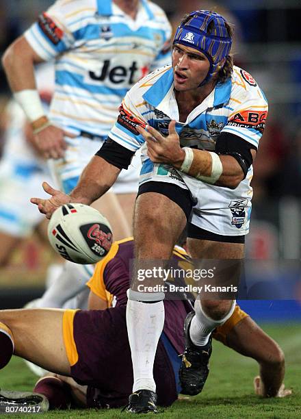 Nathan Friend of the Titans passes the ball during the round six NRL match between the Gold Coast Titans and the Brisbane Broncos at Skilled Stadium...