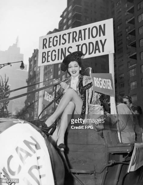 Actress Imogen Carpenter drives a horse and buggy down Broadway in the Registration Cavalcade, designed to encourage people to register to vote in...
