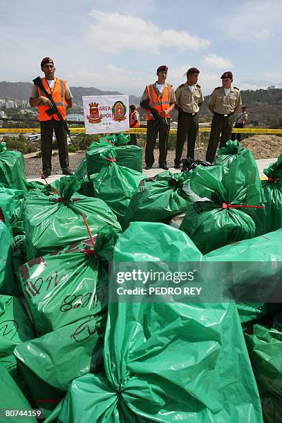Venezuela's National Guard soldiers custody packages containing three tons of drugs to be incinerated at a military barracks in Caracas on April 18,...