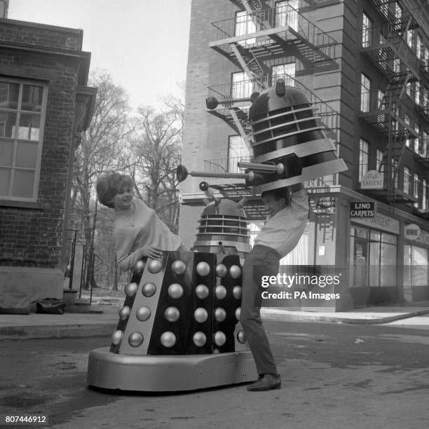 Poking around inside a Dalek at Shepperton Studios are Roy Castle and Jennie Linden, during filming for "Dr Who and the Daleks". A film based on the...