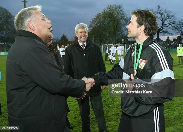 Dr. Hans Dieter Drewitz congratulates coach Sascha Lewandowski of Leverkusen after the Juniors Cup Final match between Borussia Moenchengladbach and...