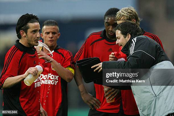 Coach Sascha Lewandowski of Leverkusen speaks with his players during the Juniors Cup Final match between Borussia Moenchengladbach and Bayer 04...