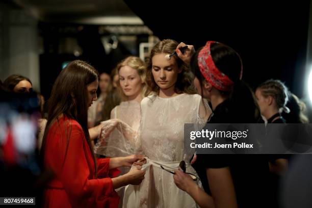 Models are seen backstage ahead of the Ewa Herzog show during the Mercedes-Benz Fashion Week Berlin Spring/Summer 2018 at Kaufhaus Jandorf on July 4,...