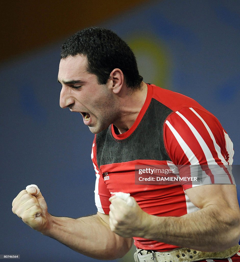 Armenia's Ara Khachatryan jubilates after a good lift in the men's