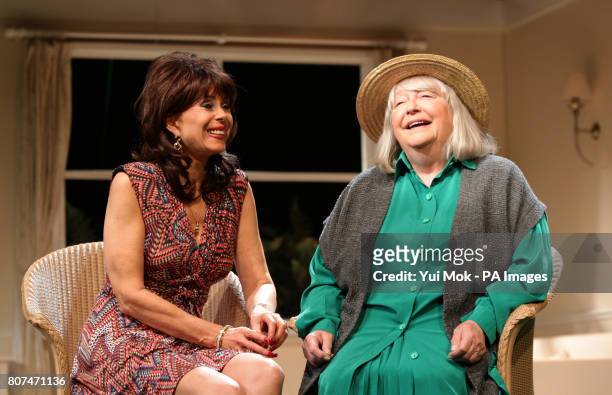 Sally Farmiloe-Neville in character as Simona and Judy Cornwell as Miss Mackensie during a photocall on stage for 'When The Lilac Blooms, My Love',...