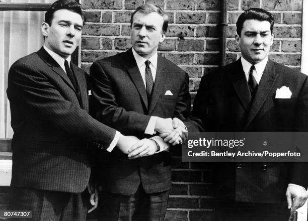 1960s East End London gangsters the Kray Brothers hold hands, They are from left to right: Ronnie, Charlie, and Reggie