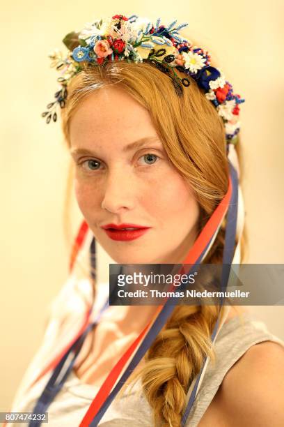 Model Sandra Hunke is seen backstage ahead of the Lena Hoschek show during the Mercedes-Benz Fashion Week Berlin Spring/Summer 2018 at Kaufhaus...