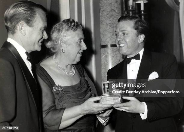 Literature, Personalities, pic: April 1958, English crime writer Agatha Christie is presented with a mousetrap by actors Richard Attenborough, right...
