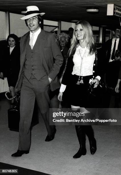 Cinema Personalities, pic: 23rd April 1968, French actress Brigitte Bardot, ,arrives in London escorted by her brother in law Patrick Bauchau,...