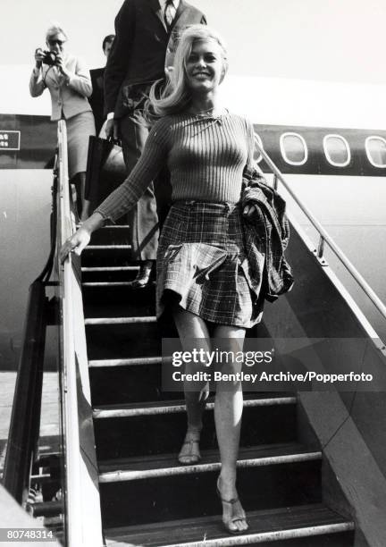 Cinema Personalities, pic: 2nd September 1966, French actress Brigitte Bardot, , arrives a London Airport dressed in a mini-skirt, Brigitte Bardot,...