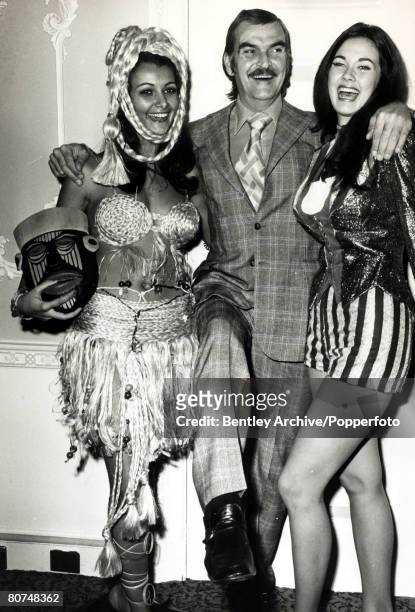 Cinema Personalities, pic: 25th November 1972, Welsh actor Stanley Baker, pictured with Miss World contestants in their national costumes, Miss...
