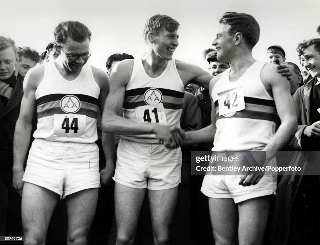 Athletics Oxfordshire, England. 6th May, 1954. Roger Bannister shakes hands with Chris Brasher (left) and Chris Chataway after he completed the historic four minute mile record.