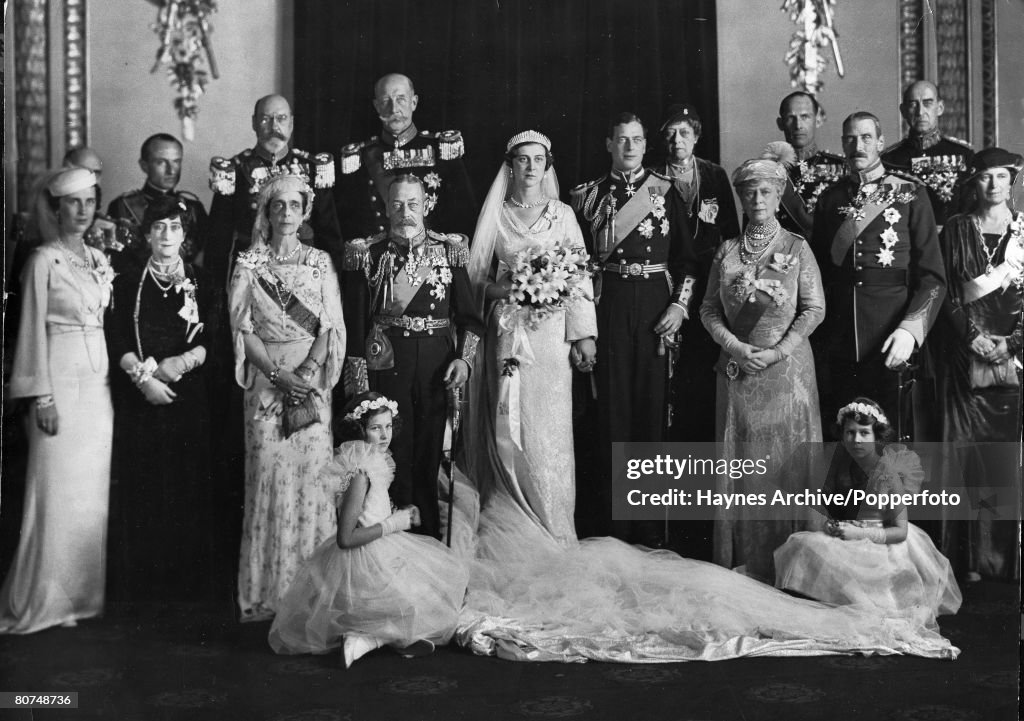 British Royalty pic: 1934. The wedding of HRH.The Duke of Kent to HRH. The Princess Marina of Greece, pictured here at Buckingham Palace, the couple flanked by King George V and Queen Mary and the family.