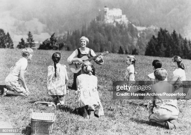 Cinema Personalities, pic: 1965, British film actress Julie Andrews, centre, with the children in a still from the film "The Sound of Music"