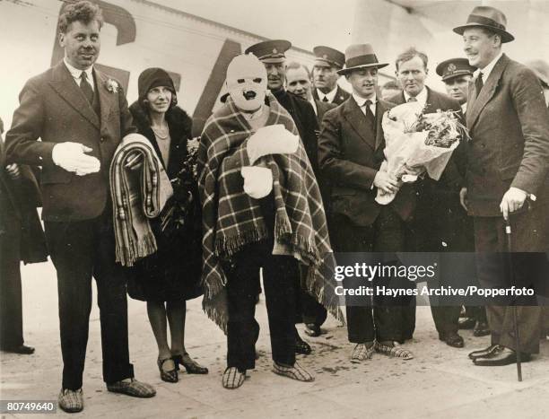 Croydon, England, The last three survivors of the R-101 Airship disaster in Beauvais, France arrive home heavily bandaged, L-R in hospital slippers:...