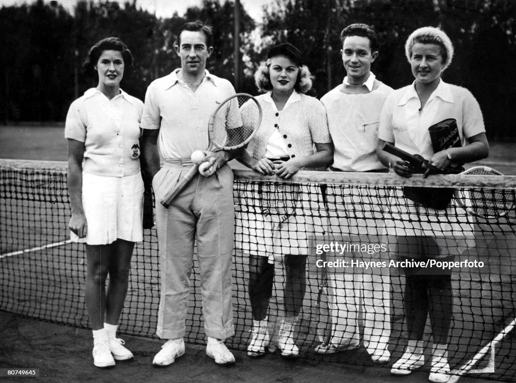 Tennis circa 1940's. Five members of the United States tennis team line up for a photograph. They are L-R: Sarah Palfrey de Cooke, Elwood T. Cooke, Jane Stanton, Frank Guernsey and Dorothy May Bundy.
