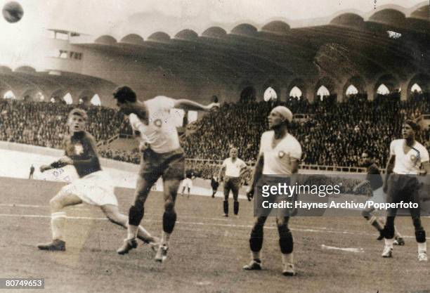 Football, 12th June 1938, Bordeaux, France, World Cup Finals, Quarter-Final, Brazil 2 v Yugoslavia 1, A Brazilian defender heads clear from a...
