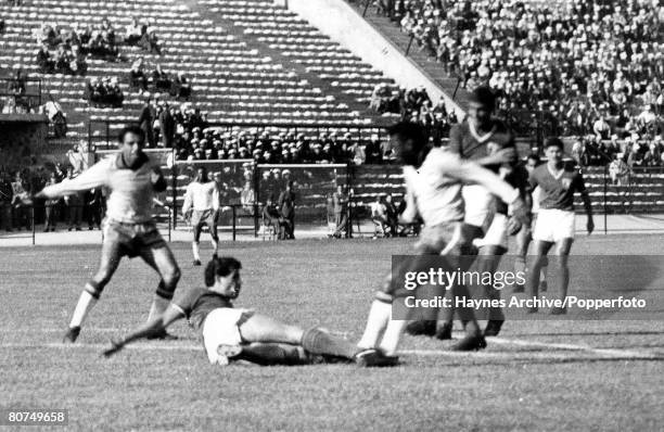 Football, 30th May 1962, Vina Del Mar, Chile, World Cup Finals, Group 3, Brazil 0 v Mexico 0, Brazil's Pele is tackled by a Mexican defender during...