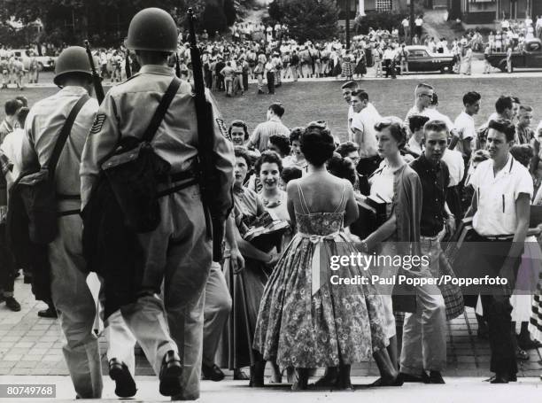 Race Relations, Education, USA, pic: 1950's, Little Rock, Arkansas, White students about to enter Central High School as National Guardsmen prepare...