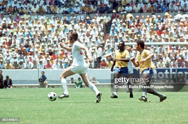 World Cup Finals, Guadalajara, Mexico 7th June England 0 v Brazil 1, England's Jeff Astle gets away from Brazilians Pele and Rivelino during the two...