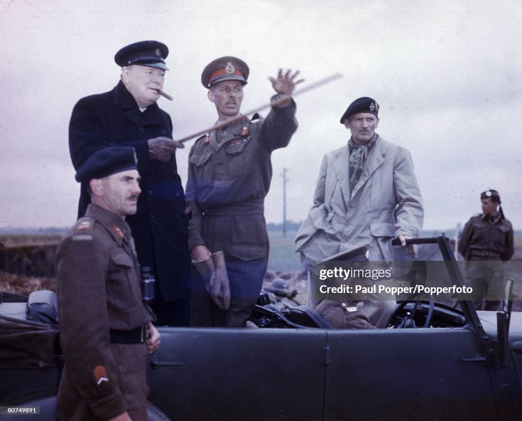 War & Conflict World War Two. Caen, France. 22nd July 1944. Enemy postions being pointed out to the Prime Minister Winston Churchill by Lt. General Sir Miles Dempsey. To the left is Lt. General Simonds, 2nd canadian Corps and to the right is General Sir