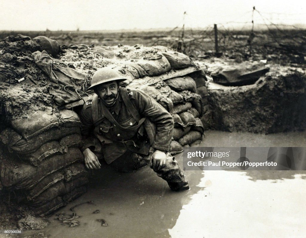 War and Conflict World War I. (1914-1918) Western Front. pic: January 1917. A British soldier in a flooded dug-out in a front line trench near Ploegsteert Wood, Flanders.