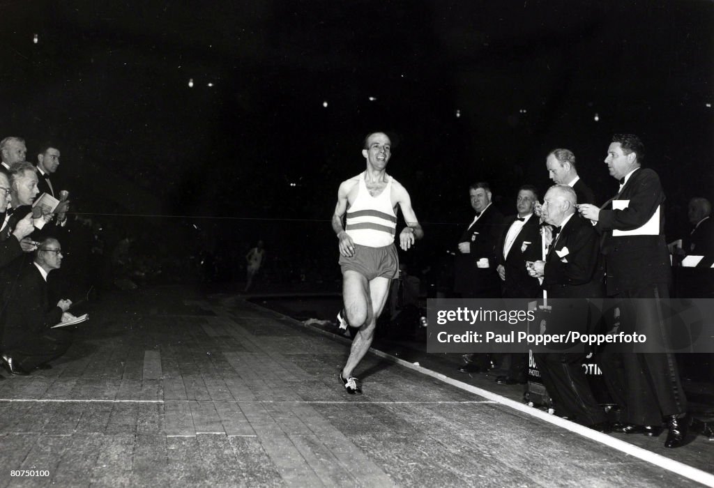 Sport Athletics. 1952 Olympic Games in Helsinki. pic: 1954. Luxembourg's Josy Barthel delighted as he comes home alone to win the Wanamaker Mile race at Madison Square Garden, New York. The 1952 Olympic Games champion Josef "Josy" Barthel of Luxembourg,