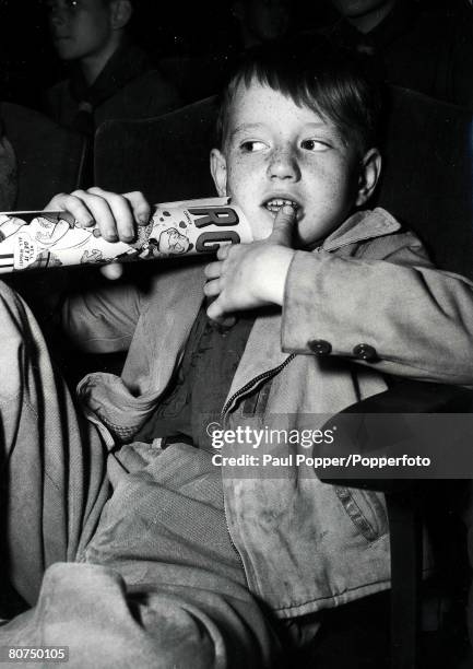 Classic Collection, Page 21 Freckle-faced boy sitting in cinema seat with rolled-up comic, chewing his thumb