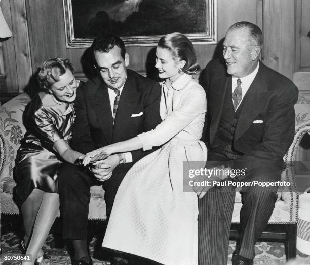 Royalty, Philadelphia, USA, 10th January 1956, Prince Rainier of Monaco and film actress Grace Kelly show off the engagement ring to her mother at...
