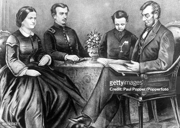 Picture of Abraham Lincoln , the President of the United States from 1860-65, reading the bible to members of his family L-R: Mrs Lincoln, his son...