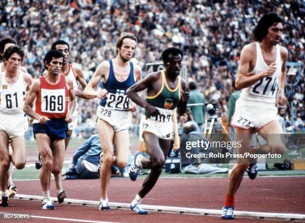 Athletes competing in the final of the Men's 10,000 metres event with, from left, eventual silver medallist Emiel Puttemans of Belgium , Mariano Haro...