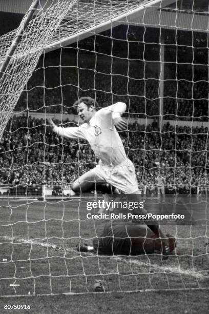 11th April 1970, FA, Cup Final at Wembley, Chelsea 2 v Leeds United 2, a,e,t, Leeds United's Billy Bremner hurdles Chelsea goalkeeper Peter Bonetti...