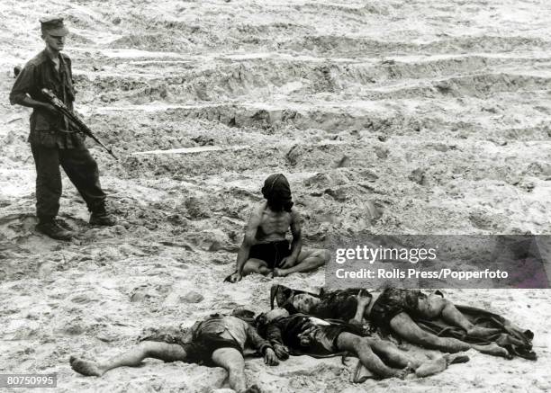 War and Conflict, The Vietnam War, near Da Nang, South Vietnam, pic: September1965, A captured Viet Cong prisoner sits hooded and guarded by an...