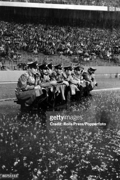 26th June 1974, 1974 World Cup Finals in Gelsenkirchen, Holland 4 v Argentina 0, Pouring rain continues as German policeman are forced to sit in the...