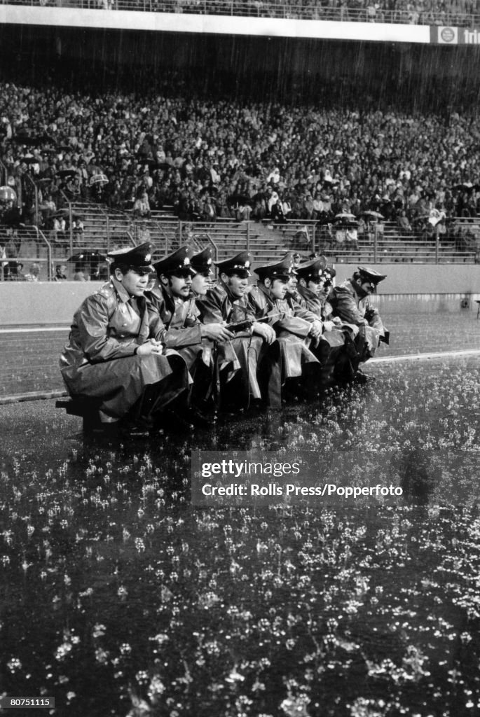 Sport Football. pic: 26th June 1974. 1974 World Cup Finals in Gelsenkirchen. Holland 4 v Argentina 0. Pouring rain continues as German policeman are forced to sit in the open.