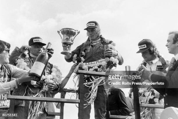 Sport, Motor Racing, Formula One, pic: 16th July 1977, British Grand Prix at Silverstone, The Grand Prix winner, Britain's James Hunt, centre with...
