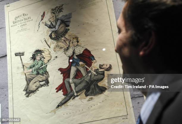 Person views Fred W Rose's Comic Map of the Political Situation in 1880, a pro-Tory poster showing a robed Benjamin Disraeli dealing a death blow to...