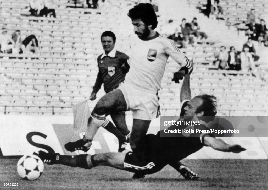 Sport Football. pic: 11th June 1978. 1978 World Cup Finals in Argentina. Scotland 1 v Iran 1. in Cordoba. Scotland's Archie Gemmill slides in to tackle Iran's Hassan Nazari.
