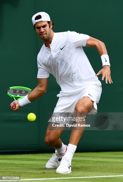 Karen Khachanov of Russia returns a shot during the gentlemen's singles first round match against Andrey Kuznetsov of Russia on day one of the...