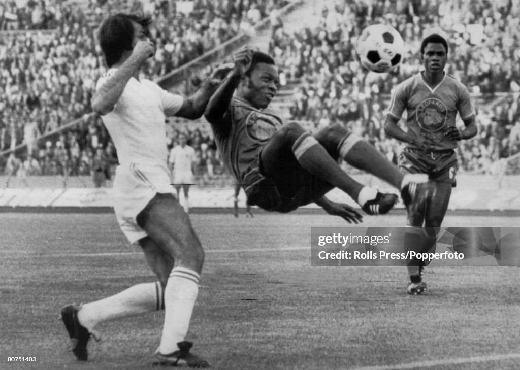 Sport Football. pic: 18th June 1974. 1974 World Cup Finals in Germany. Gelsenkirchen. Group Match. Yugoslavia 9 v Zaire 0. Zaire defender Ilunga Mwepu clears with an acrobatic overhead kick from Yugoslavia's Dusan Bajevic.