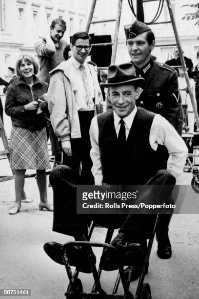 Stage and Screen, Personalities, pic: May 1966, British actor Tom Courtenay , pictured pushing actor Peter O'Toole in a whellbarrow during filming of...