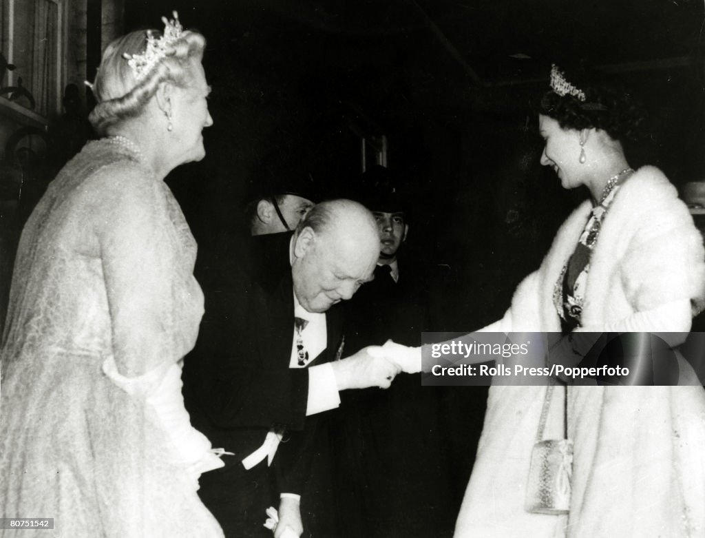 British Politics / Royalty pic: April 1955. Sir Winston Churchill, watched by Lady Churchill, greets H.M.Queen Elizabeth II as she arrives at No 10 Downing Street London. This at the time Sir Winston was to retire from political life at the age of 80.