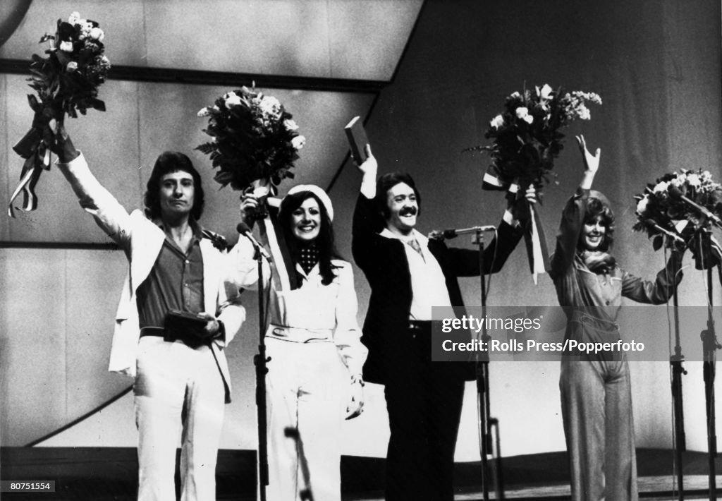 Music Personalities pic: 4th April 1976. The Hague. The Eurovision Song Contest. British pop group "Brotherhood of Man" celebrate their victory with the song "Save Your Kisses For Me", left-right, Lee Sheridan, Sandra Stevens, Martin Lee, Nicky Stevens.
